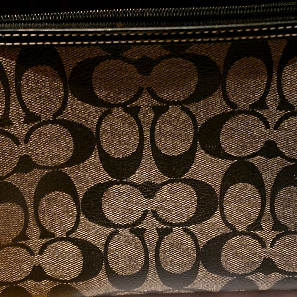 Make up purse or clutch bag made by coach
